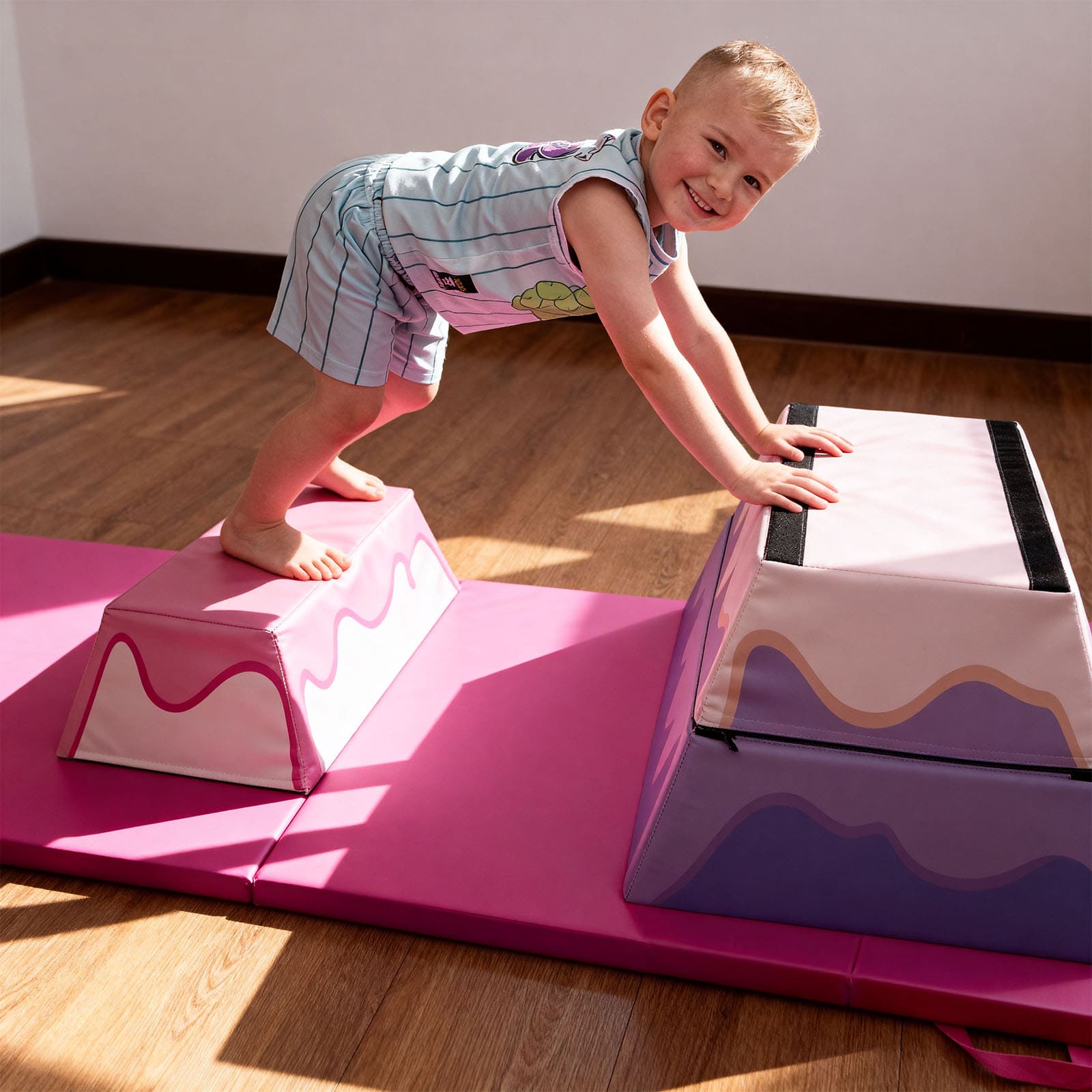 Child playing on a 3-Layer Cake Themed Foam Vaulting Box