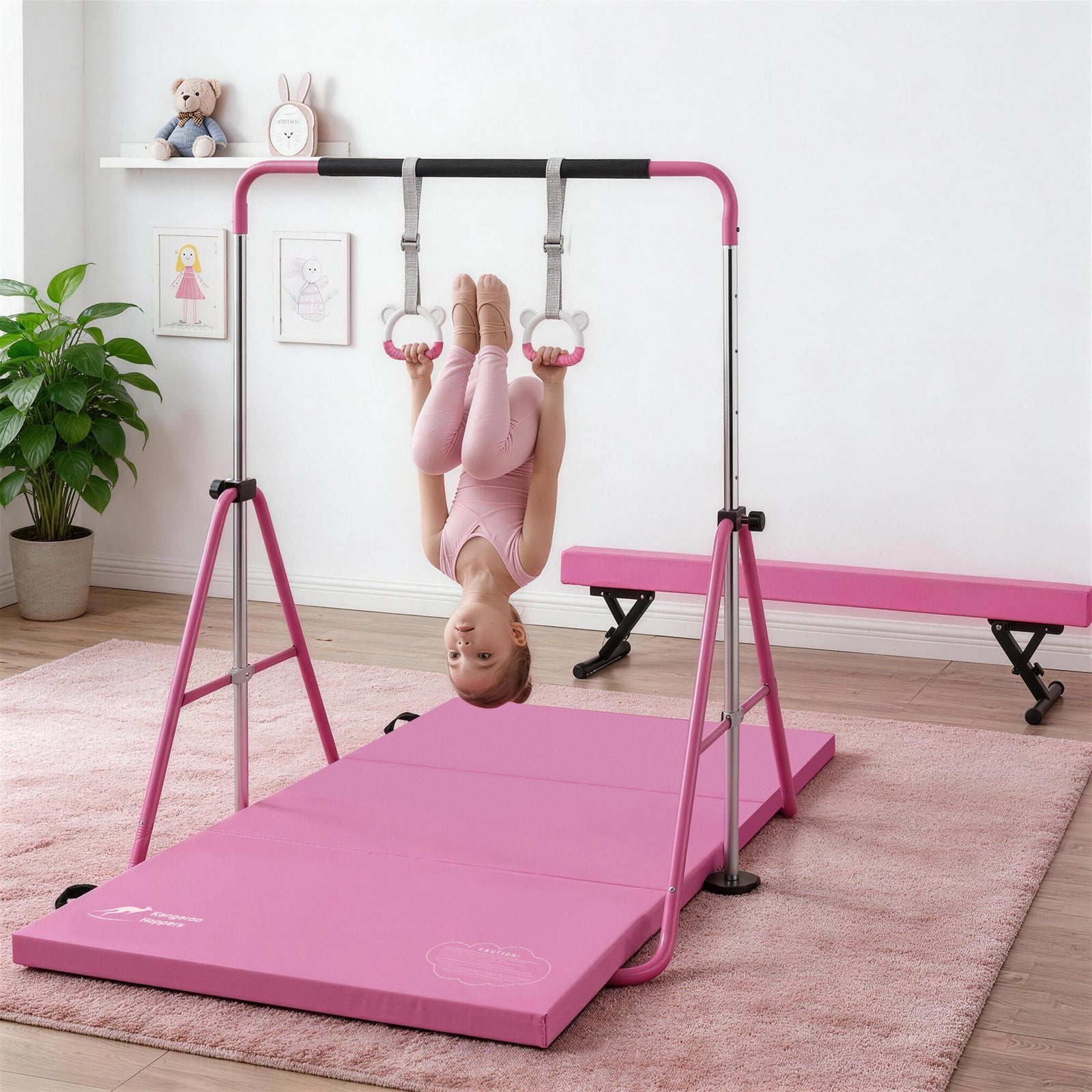 Child hanging from pink All-in-One Kids Strength & Balance Training Set with mat