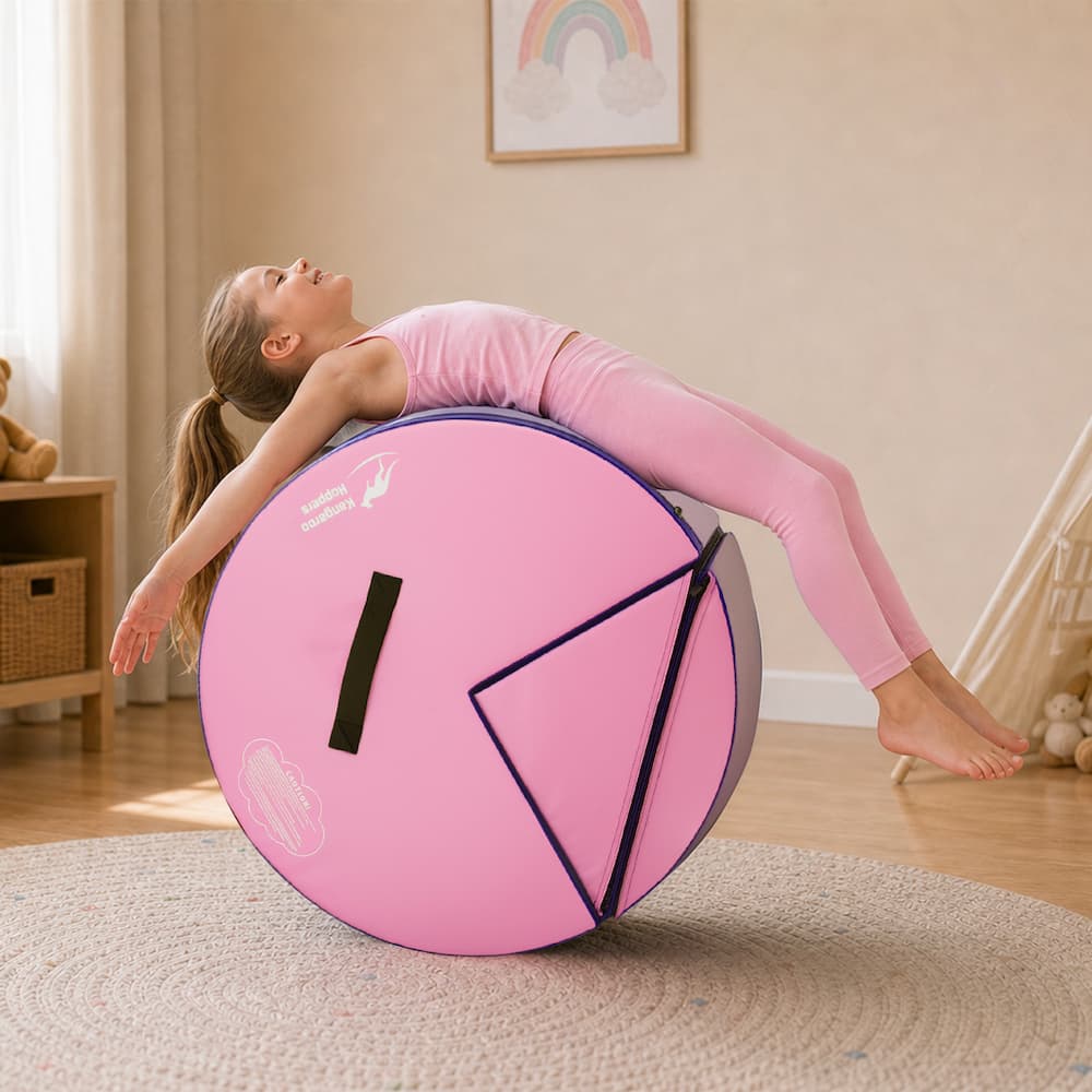 Girl doing backbend over pink Kangaroo Hoppers Flip & Roll Gymnastics Trainer cylinder