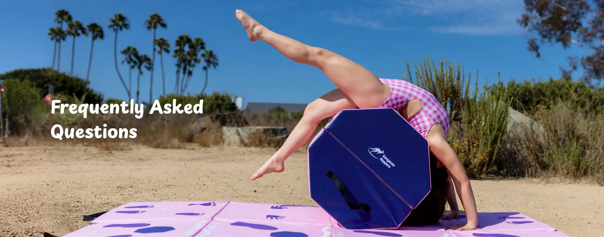 Gymnast performing backbend on purple mat with blue octagonal tumbler outdoors