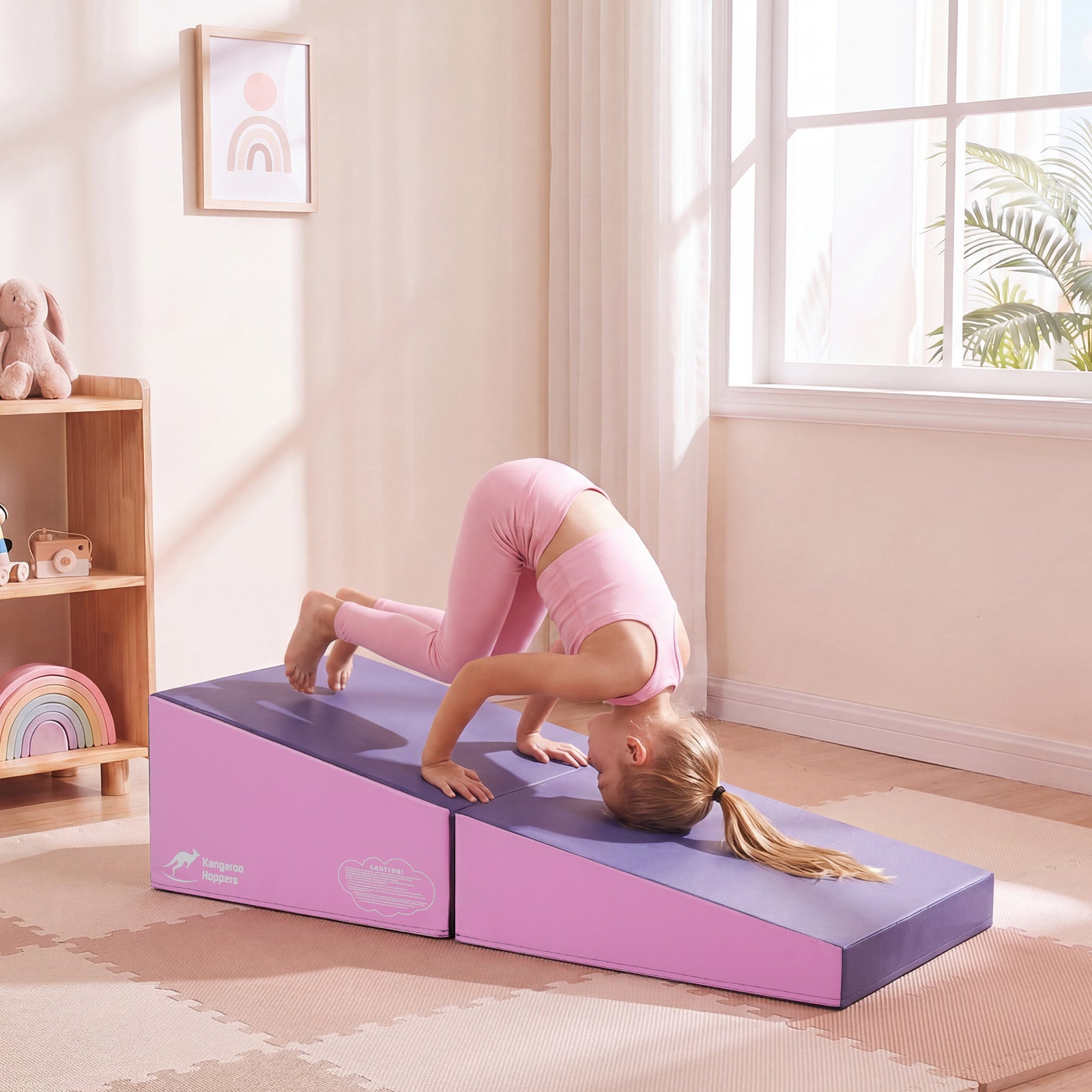 Child practicing tumbling and forward roll skills on a modular gymnastics training mat