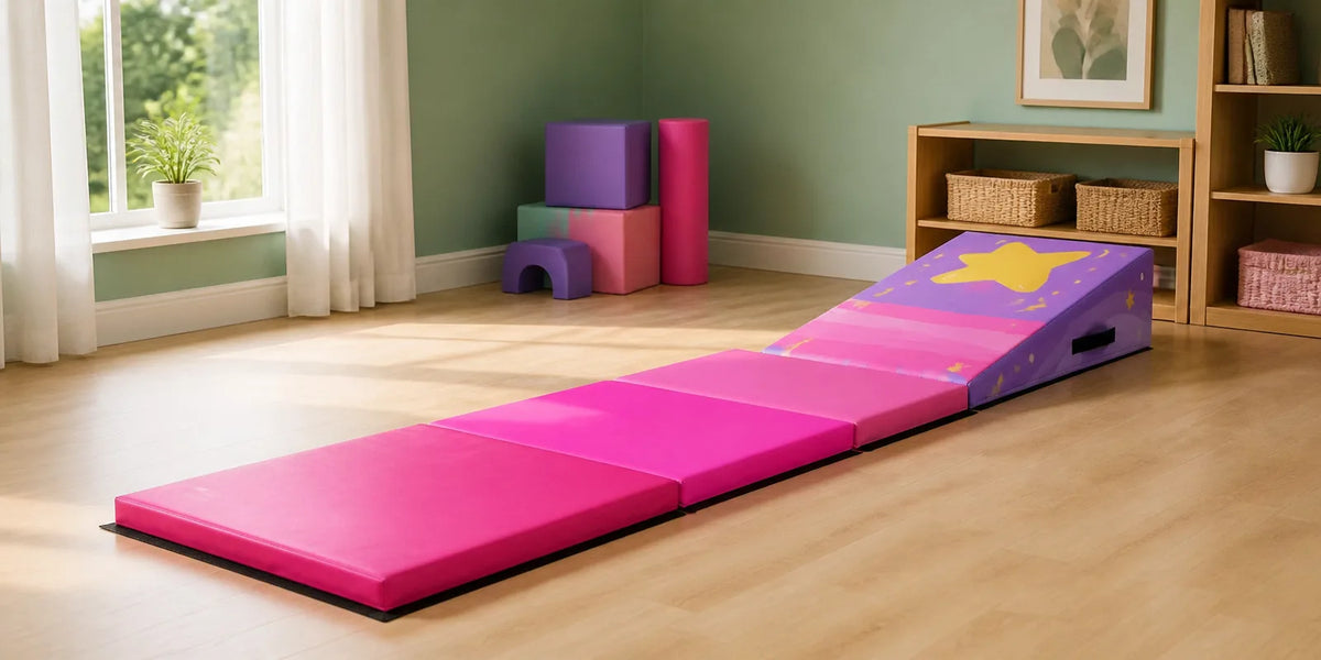Pink cheese wedge incline mat practice setup for kids gymnastics