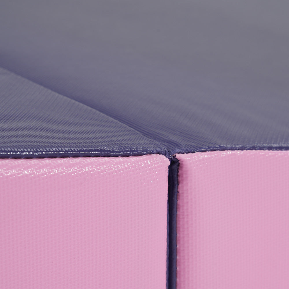 Pink and dark grey padded foam matcorner detail showing stitched seams