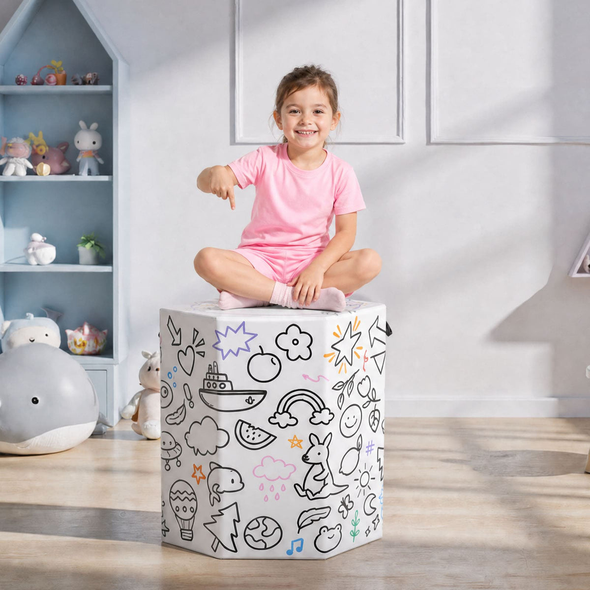 Girl sitting on white Kangaroo Hoppers Octagon Trainer Mat with colorful doodle fun design in playroom