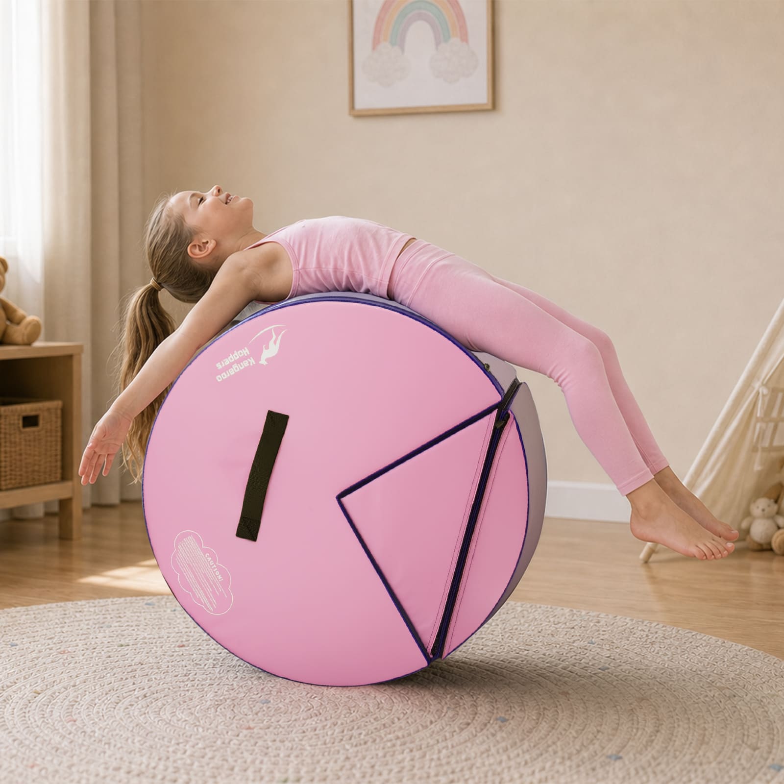 Girl doing backbend over pink Kangaroo Hoppers Flip & Roll Gymnastics Trainer cylinder