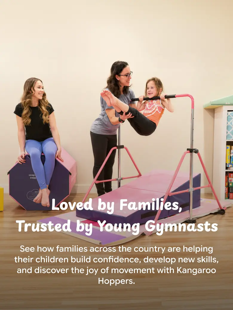 Girl using pink Kangaroo Hopper bar with purple foam mat while mother assists and sister watches nearby