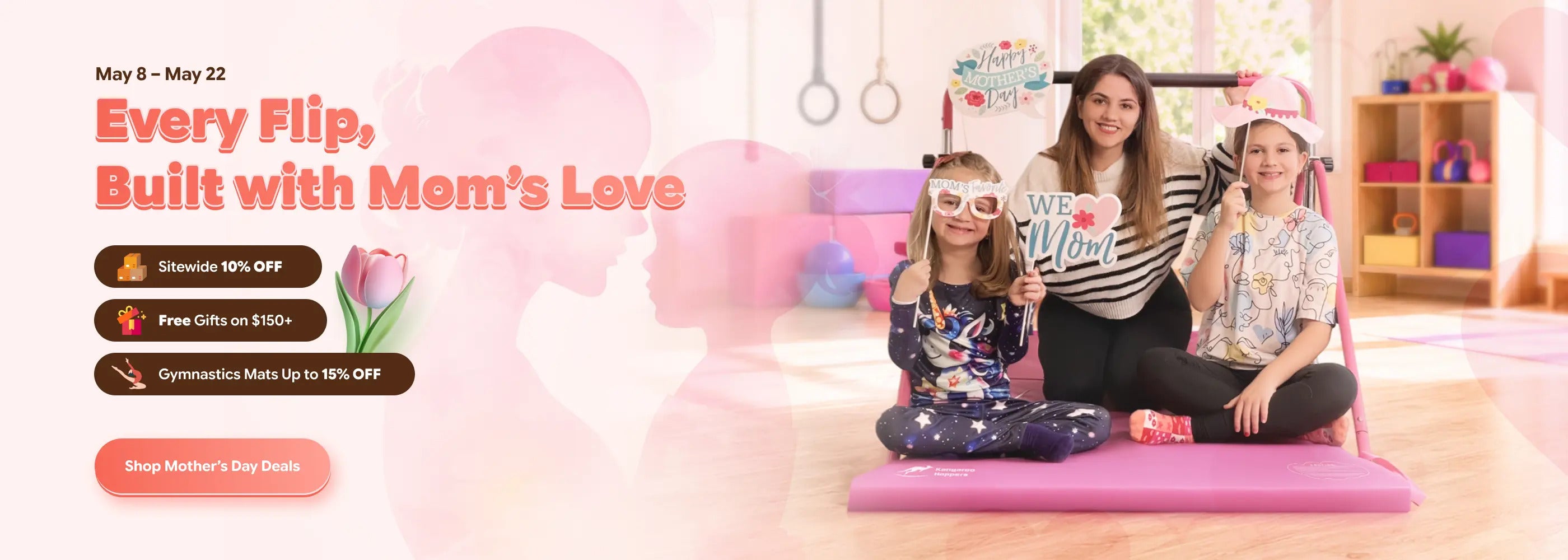Two women and a child sitting on a pink mat in a room with exercise equipment, promotional text for a product line.