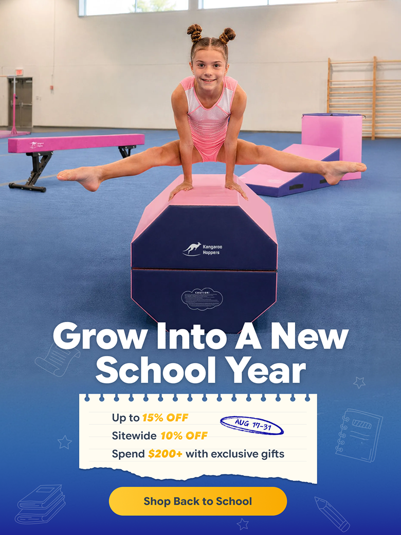 Girl doing straddle split on pink and blue Kangaroos Hoppers gymnastics vault in gym
