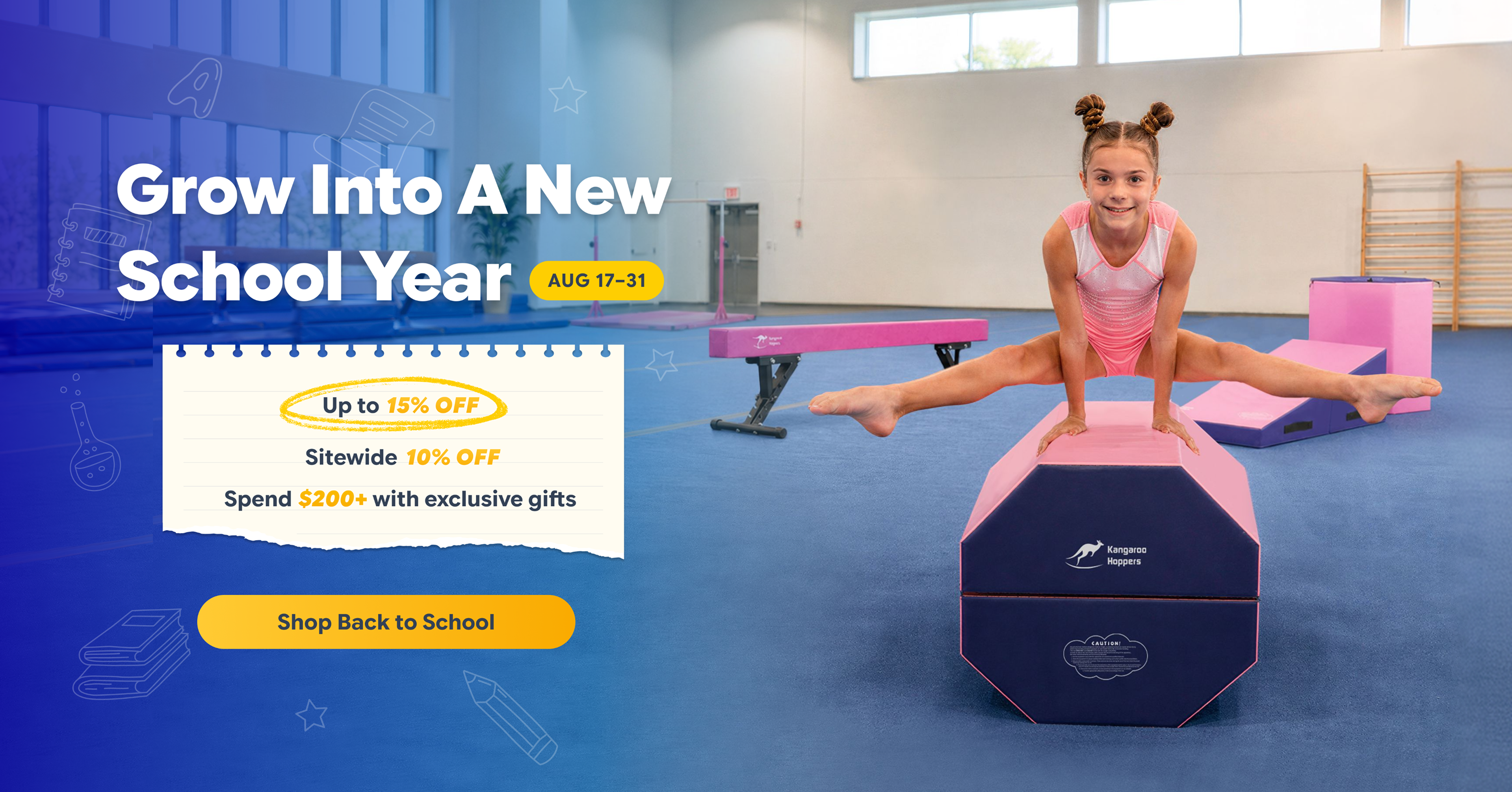 Girl doing splits on pink and navy gymnastics vault in gym